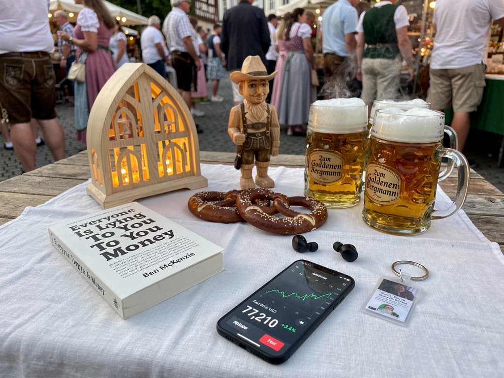 Stollberg Marktplatz-Festival mit Ben McKenzie Buch, Crypto-Charts auf Handy, Bergbau-Symbole und Bierstand